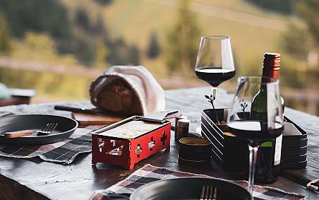 A rustic breakfast on a bench in nature.