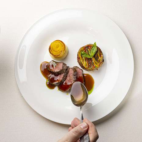 Diverse, artistically arranged dishes on a table.